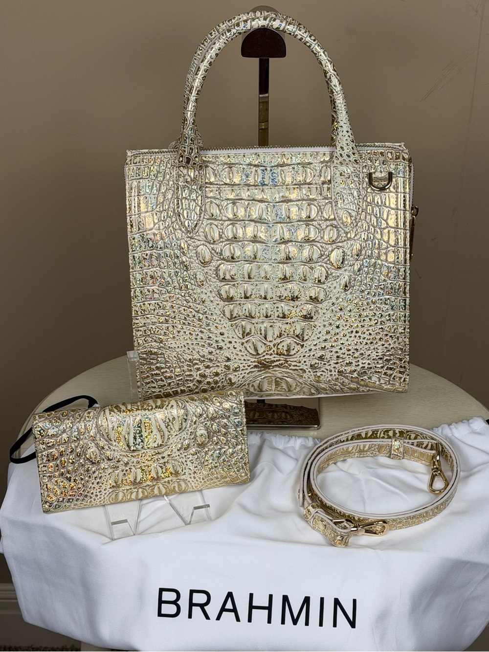 NWT Brahmin Caroline Satchel in champagne gold hologram with matching wallet.